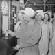 Women punching in at a munitions factory